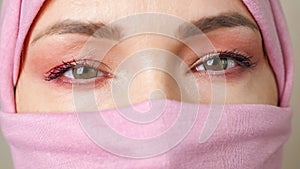 Close-up eyes of a muslim woman wearing a closed hijab
