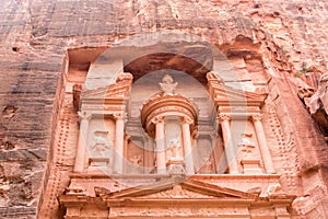 Close-up of facade Al-Khazneh with urn in Petra Jordon.