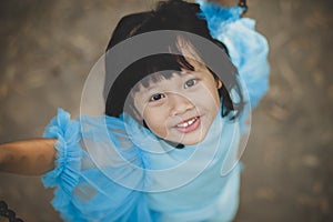 Close up face asian girl children toothy smiling face happiness emotion looking to camera