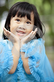 Close up face asian girl children toothy smiling face happiness emotion looking to camera