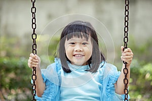 Close up face asian girl children toothy smiling face happiness emotion looking to camera