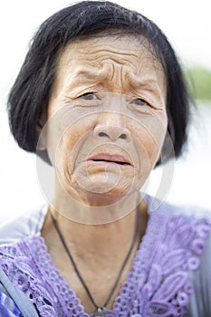 Close up face of asian senior woman crying emotion