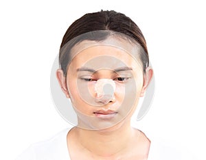 Close up face of asian woman with nose plastic surgery for beauty and cosmetic conept, white background
