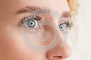 Close up of face of beautiful caucasian young woman, focus on eyes