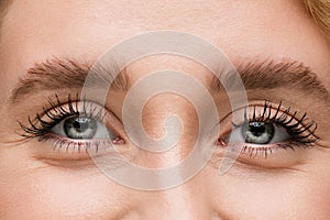 Close up of face of beautiful caucasian young woman, focus on eyes