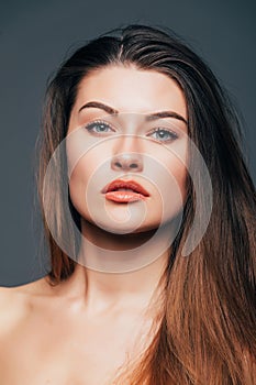 Close up of face beauty girl skin on grey background. Cosmetics or spa, healtcare concept.