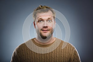 Close up face of discouraged man isolated grey background photo