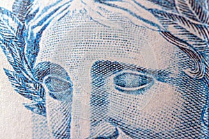 Close-up of the face of Effigy of the Republic, detail of Brazilian banknote, concept of savings or investment