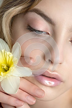 Close up face of fashion model with  professional holographic, radiant lip make-up