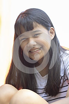 Close up face of forelocik hair asian teenager toothy smiling fa