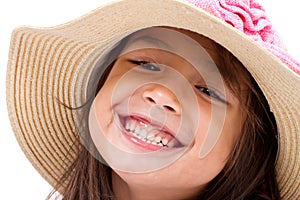 Close up face of happy, smiling female asian caucasian kid