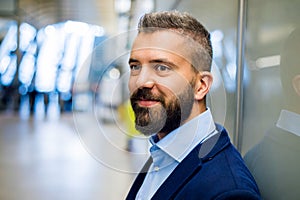 Close up of face of hipster businessman, subway station