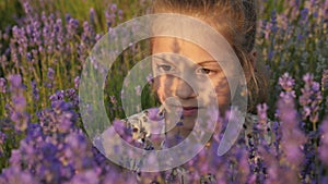 Close up face lovely little girl, field lavender