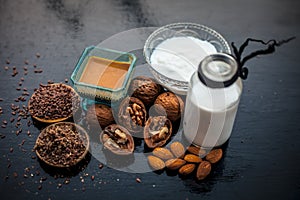 Close up of face mask or face pack of walnut along with flax seed or alsi, almonds,yogurt and milk in a glass bowl   entire raw in