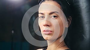 Close-up face of powerful confidence Asian boxing girl with natural beauty looking at camera