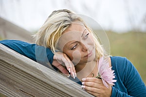 Close-up face of pretty young woman thinking