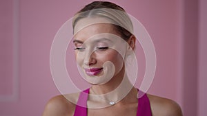 Close-up face of slim beautiful woman raising palm looking at camera with surprised facial expression. Closeup portrait