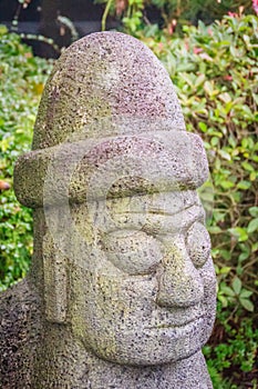 Close up face of the stone idol Dolharubang