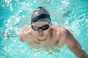 Close up face of swimming swimmer in water