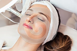 Close-up of the face of a woman relaxing during non-surgical fac