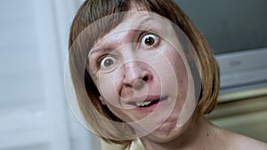 Close-up Facial Expressions of a Crazy Woman with Bulging Eyes, Crooked Teeth