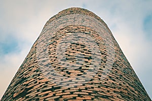 Close-up of factory brick chimney. Air Pollution by Industrial Emissions