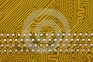 Close-up of a factory printed circuit board of electronics with pin tracks. Electronic background green tint