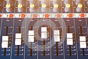 Close up fader of sound mixer old Volume adjusting knobs controller in control room