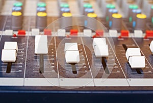 Close up fader of sound mixer old Volume adjusting knobs controller in control room and water drops