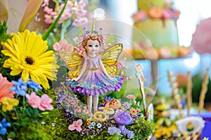 Close Up of a Fairy Figurine Surrounded by Flowers, Fantasy fairy garden with delightful and vibrant colors for a birthday theme,