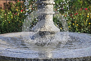 Close-up of a falling water in the fountain