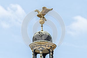 Close-up of the famous eagle, which stands on the dome of the roof of Das Neue Palast, at Sanssouci in Potsdam Germany. photo