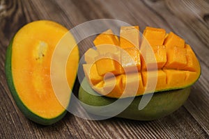 Close up of famous sweet mango called Harum Manis isolated on top of wooden background