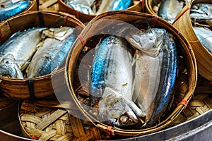 Close up The famouse Thai traditional Steamed mackerel fish in basket bamboo or wicker basket in thailand market