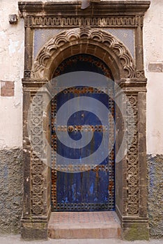 Close up of fancy blue door with ornate carvings, Essaouira, Morocco