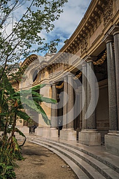 Close-up of the far-fetched decoration of arch and columns at the Petit Palais courtyard in Paris.