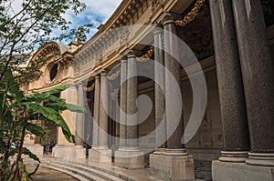 Close-up of the far-fetched decoration of arch and columns at the Petit Palais courtyard in Paris.