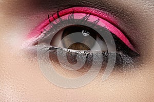 Close-up of fashion eyes make-up, bright pink eyeshadow