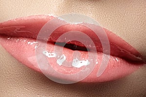 Close-up fashion lips with tender gloss make-up