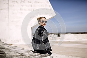 Close up fashion ;luxury portrait of stunning woman, full perfect lips and face, sunny day sunglasses and leather jacket, big