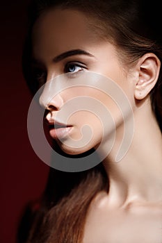 Close-up fashion portrait of attractive girl with perfect skin