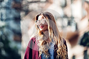 Close up fashion street stile portrait of pretty girl in fall casual outfit Beautiful blond posing outdoor.