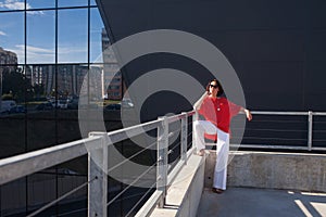 Close-up Fashion woman portrait posing at the city in Europe, summer street fashion. Portrait of a beautiful business woman