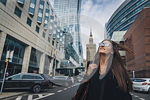 Close-up Fashion woman portrait of young pretty trendy girl posing at the city in Europe. Beautiful stylish woman in