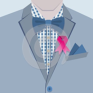 Close up of fashionable male in blue suit and pink ribbon pin on collar