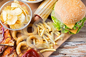 Close up of fast food snacks on wooden table
