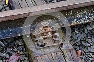 Close-up on the fastener of a railroad track holding rail to sleeper or crosstie