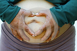 Close-up of fat woman on white background. Concept for obesity issue, diet of food for health