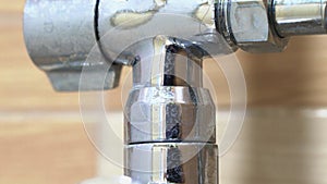 Close-up of a faucet in the kitchen with a lime coating