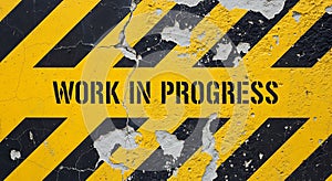 Work in Progress stencil on damaged caution sign